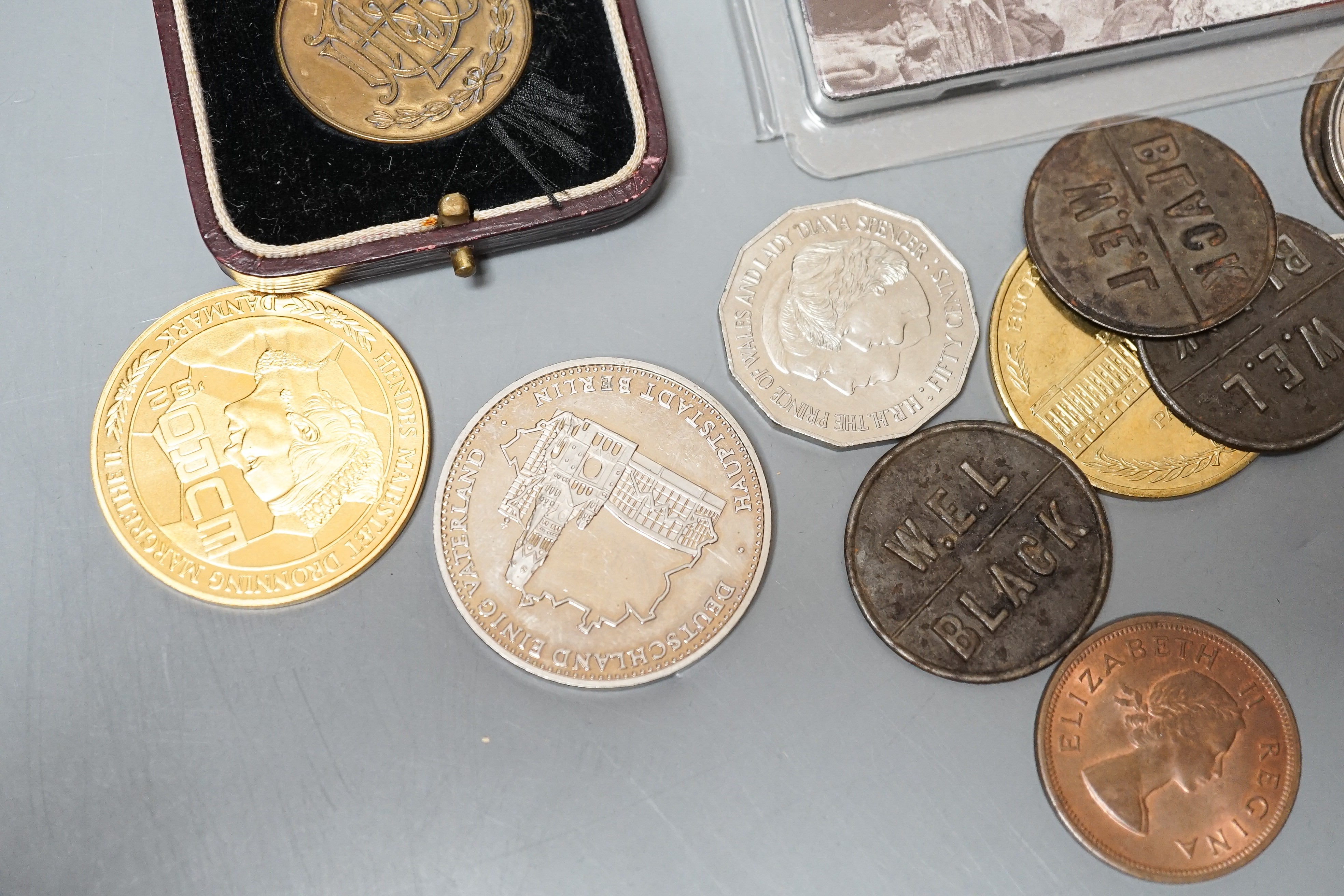 A collection of military badges and a collection of coins